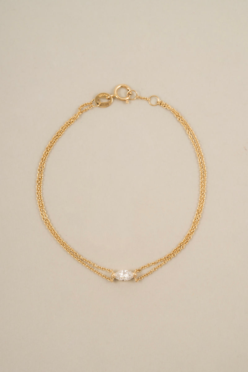 14k gold bracelet with a sideways marquise lab-grown diamond