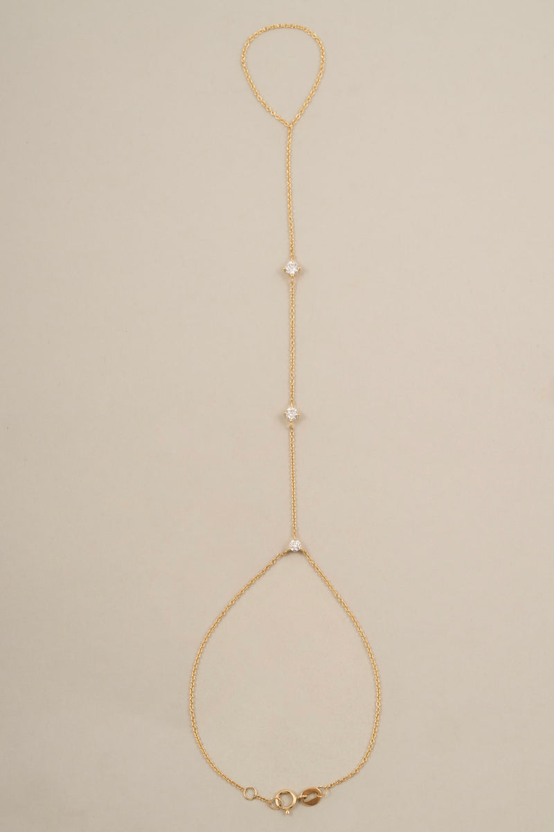 14k solid gold hand chain bracelet with lab-grown diamonds, worn across the hand